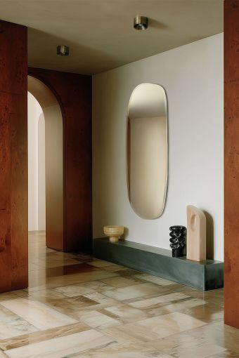 Pure Hall irregular wall mirror styled in an interior, highlighting irregular-shaped wall mirror.