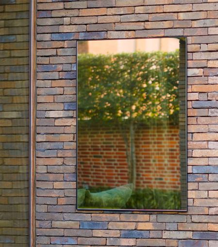 Lucka Outdoor Black Rect. rectangular wall mirror styled in an interior, highlighting rectangular outdoor wall mirror.