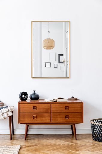 Soho Gold Small Rect. rectangular wall mirror styled in an interior, highlighting gold-finished synthetic frame.