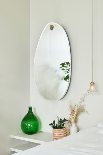 Globo Lago irregular wall mirror styled in an interior, highlighting irregular-shaped wall mirror.