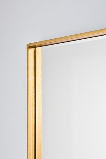 Close-up of Soho Gold Hall, showing gold-finished frame on the rectangular wall mirror.