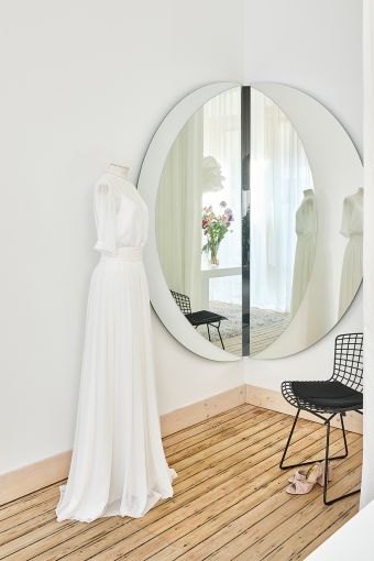 Luna Black Corner M round wall mirror styled in an interior, highlighting round corner-mounted mirror.