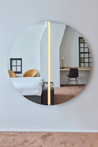 Luna Light Round M round wall mirror styled in an interior, highlighting round mirror with integrated LED light.