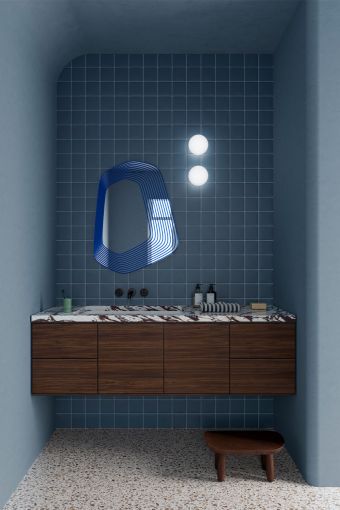 Vibe Blue irregular wall mirror styled in an interior, highlighting irregular-contour wall mirror.