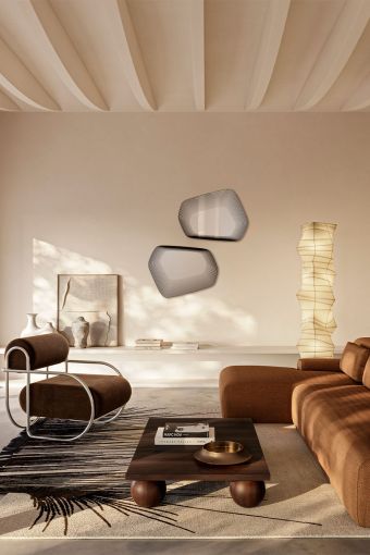 Vibe Black irregular wall mirror styled in an interior, highlighting black receding outline pattern.