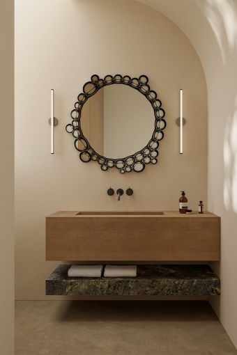 Bubbles styled in an interior, highlighting irregular mirror formed by overlapping circular bubble shapes.